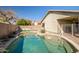 Inviting backyard pool area with mature landscaping and privacy wall at 9331 W Harmony Ln, Peoria, AZ 85382