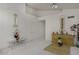 Minimalist living room design with white walls at 1009 E Brentrup Dr, Tempe, AZ 85283