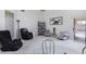 Cozy living room with various seating options and sliding door access to backyard at 1009 E Brentrup Dr, Tempe, AZ 85283