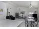Open-concept living area with tile flooring, high ceilings, and a dining table at 1009 E Brentrup Dr, Tempe, AZ 85283