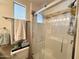 Bright bathroom featuring a glass enclosed shower and a tiled backsplash at 1027 S Prospector Dr, Apache Junction, AZ 85119