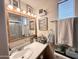 A bathroom with vanity, mirror, and decorative wall art at 1027 S Prospectors Dr, Apache Junction, AZ 85119