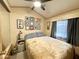 Cozy bedroom featuring a ceiling fan and patterned wall art at 1027 S Prospector Dr, Apache Junction, AZ 85119