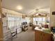Bright dining area adjacent to the kitchen, enhanced by a ceiling fan and natural light at 1027 S Prospector Dr, Apache Junction, AZ 85119