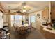 Charming dining area with natural light, complemented by a ceiling fan for added comfort at 1027 S Prospectors Dr, Apache Junction, AZ 85119