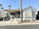 Inviting single-story home showcasing desert landscaping and a covered porch at 1027 S Prospector Dr, Apache Junction, AZ 85119