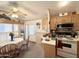 Cozy kitchen features a ceiling fan, a breakfast nook and linoleum flooring at 1027 S Prospector Dr, Apache Junction, AZ 85119