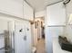 Bright laundry room features cabinet and access to the laundry area at 1027 S Prospector Dr, Apache Junction, AZ 85119