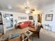 Inviting living room with comfortable orange sofa and access to the bathroom at 1027 S Prospector Dr, Apache Junction, AZ 85119