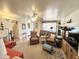 Open-concept living room with views into the entryway and comfortable seating areas at 1027 S Prospector Dr, Apache Junction, AZ 85119