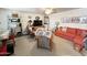 Living room featuring a sofa, shelving, and a TV for relaxation and entertainment at 1027 S Prospector Dr, Apache Junction, AZ 85119