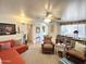 Cozy living room featuring a ceiling fan, comfortable seating, and an inviting atmosphere at 1027 S Prospector Dr, Apache Junction, AZ 85119