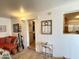 Living room showing the view towards the doorway and passthrough window to the kitchen at 1027 S Prospector Dr, Apache Junction, AZ 85119