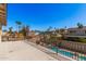 Balcony overlooking pool and backyard with lush tropical landscaping at 1027 W Natal Ave, Mesa, AZ 85210