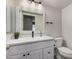 Bathroom with a single vanity and an all-white design and decor at 1027 W Natal Ave, Mesa, AZ 85210