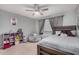 Charming bedroom with ceiling fan, window with blinds, and plenty of space for storage and decor at 1027 W Natal Ave, Mesa, AZ 85210