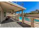 Spacious covered patio overlooking a pool and backyard, complete with ceiling fans and patio furniture at 1027 W Natal Ave, Mesa, AZ 85210