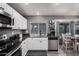 Updated kitchen features gray countertops and stainless steel appliances at 1027 W Natal Ave, Mesa, AZ 85210