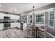 Bright eat-in kitchen with stainless steel appliances and lots of natural light and pool view at 1027 W Natal Ave, Mesa, AZ 85210