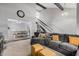 Open-concept living room with visible staircase and connected dining area at 1027 W Natal Ave, Mesa, AZ 85210