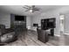 Bright living room features a fireplace, tv and functional desk area at 1027 W Natal Ave, Mesa, AZ 85210