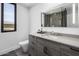 Contemporary bathroom with modern vanity and luxurious shower with stunning stone tile at 10381 E Loving Tree Ln, Scottsdale, AZ 85262