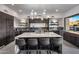 Modern kitchen featuring a large island, stainless steel appliances, and custom cabinetry at 10381 E Loving Tree Ln, Scottsdale, AZ 85262