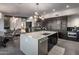 Bright kitchen with large center island, modern appliances, and access to living area at 10381 E Loving Tree Ln, Scottsdale, AZ 85262