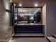 Serving bar featuring marble countertop and view of the main kitchen at 10381 E Loving Tree Ln, Scottsdale, AZ 85262