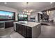 Gourmet kitchen boasts large island, stainless appliances, and seamless indoor/outdoor living at 10381 E Loving Tree Ln, Scottsdale, AZ 85262