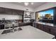 Chef's kitchen featuring a large island, premium appliances, and marble countertops at 10381 E Loving Tree Ln, Scottsdale, AZ 85262
