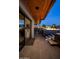 Outdoor kitchen with built-in grill, pizza oven, and covered patio space at 10381 E Loving Tree Ln, Scottsdale, AZ 85262