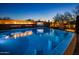 Relaxing pool with fire feature, a built-in bar, and scenic views for outdoor enjoyment at 10381 E Loving Tree Ln, Scottsdale, AZ 85262