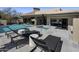 Luxury backyard featuring a pool, spa, lounge chairs, desert landscaping, and an outdoor living space at 10381 E Loving Tree Ln, Scottsdale, AZ 85262