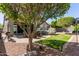 Charming backyard with a patio set, small grass yard, and a jacuzzi for entertaining at 10822 E Ramblewood Cir, Mesa, AZ 85212