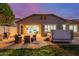 Backyard with a hot tub, outdoor seating area, and lush lawn, great for outdoor living at 10822 E Ramblewood Cir, Mesa, AZ 85212