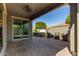 Covered patio featuring hot tub, outdoor seating and manicured landscaping at 10822 E Ramblewood Cir, Mesa, AZ 85212