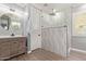 Spa bathroom with modern shower, wood-look tile, and decorative lighting at 10822 E Ramblewood Cir, Mesa, AZ 85212