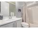 Bright bathroom featuring a modern vanity, and a shower/tub combination at 10822 E Ramblewood Cir, Mesa, AZ 85212