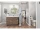 Open concept bathroom features a sleek vanity, decorative lighting, and toilet at 10822 E Ramblewood Cir, Mesa, AZ 85212