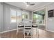 Cozy breakfast nook boasts natural light and an adjacent sliding door to a patio area at 10822 E Ramblewood Cir, Mesa, AZ 85212