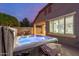 Backyard hot tub near a covered patio and outdoor seating, perfect for relaxation at 10822 E Ramblewood Cir, Mesa, AZ 85212