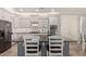 Bright, modern kitchen featuring stainless steel appliances and sleek countertops; ideal for culinary enthusiasts at 10822 E Ramblewood Cir, Mesa, AZ 85212