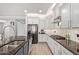 Gourmet kitchen boasts stainless steel appliances, sleek countertops, and ample storage for culinary convenience at 10822 E Ramblewood Cir, Mesa, AZ 85212
