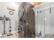 Laundry room featuring a front load washer/dryer, shelving and cleaning supplies at 10822 E Ramblewood Cir, Mesa, AZ 85212