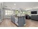 Inviting living area flows seamlessly into a gourmet kitchen, perfect for modern living and entertaining at 10822 E Ramblewood Cir, Mesa, AZ 85212