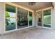 Covered patio featuring tile flooring, seating and views into the house at 10822 E Ramblewood Cir, Mesa, AZ 85212