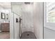 Modern shower with decorative tiling, and glass enclosure at 10822 E Ramblewood Cir, Mesa, AZ 85212