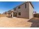 Exterior backyard with covered patio and neutral color palette at 11619 W Green Dr, Youngtown, AZ 85363