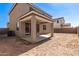 Backyard view showcasing the covered patio at 11619 W Green Dr, Youngtown, AZ 85363
